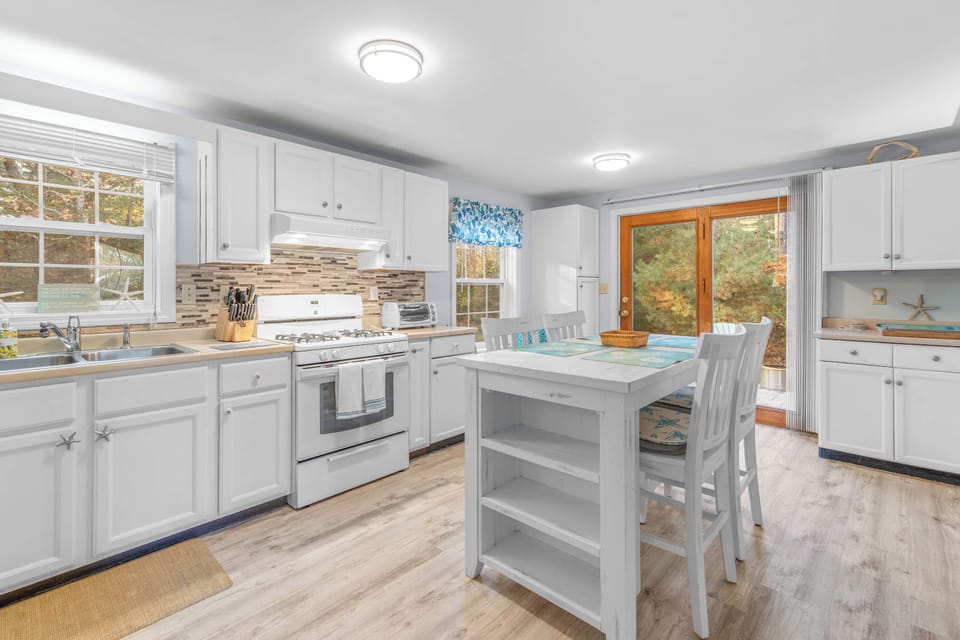 The updated kitchen offers ample space & all the comforts of home