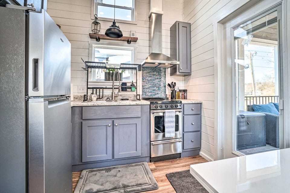 Fully equipped kitchen with stainless steel appliances and charming details—ideal for cooking up a cozy meal at home
