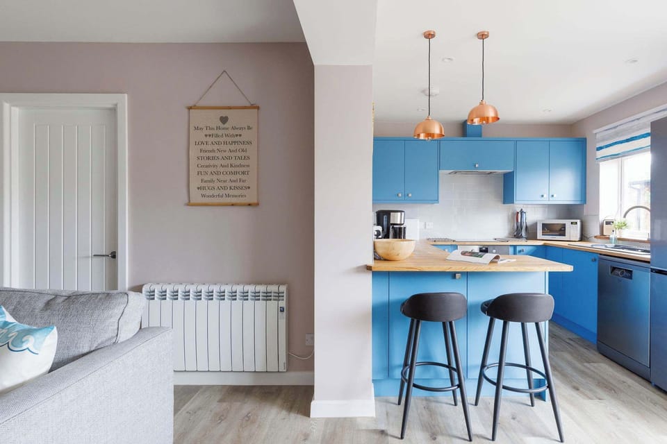 There is additional seating at the kitchen's breakfast bar.