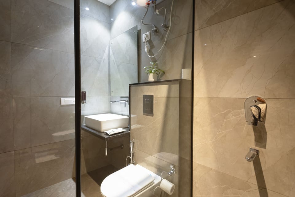 Shower, free toiletries, hair dryer, slippers