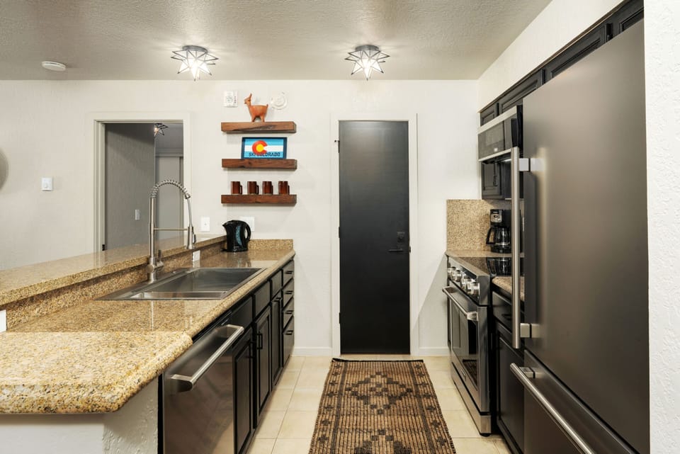 Your fully equipped kitchen awaits with modern appliances, granite countertops, and everything you need to prepare delicious meals during your mountain getaway.