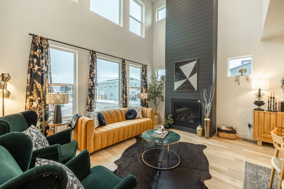 Stylish living space with high ceilings and vibrant seating