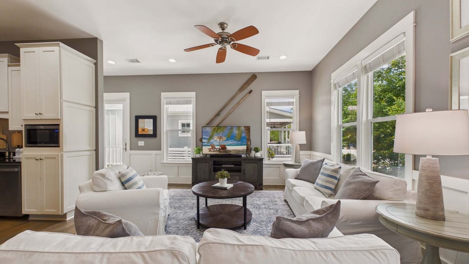Living area with stylish furnishings that allow for ample seating. Sleeper sofa in the living area. TV included.