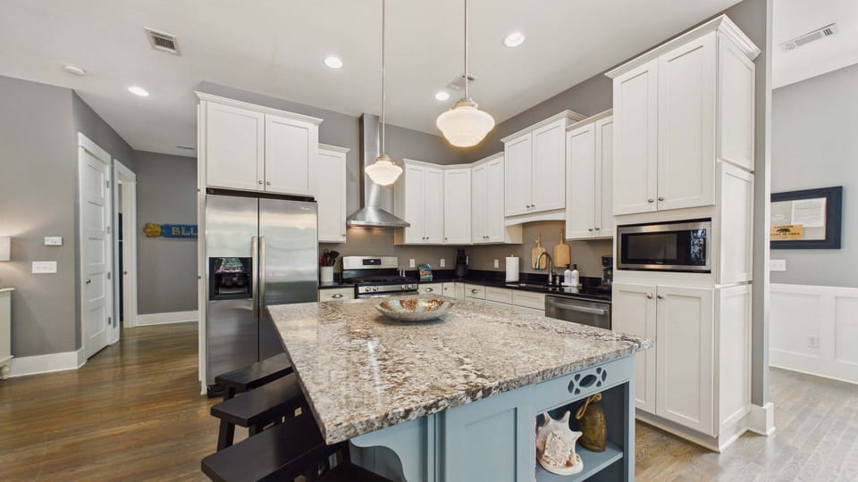 Full kitchen with all the cooking essentials and island with breakfast bar seating