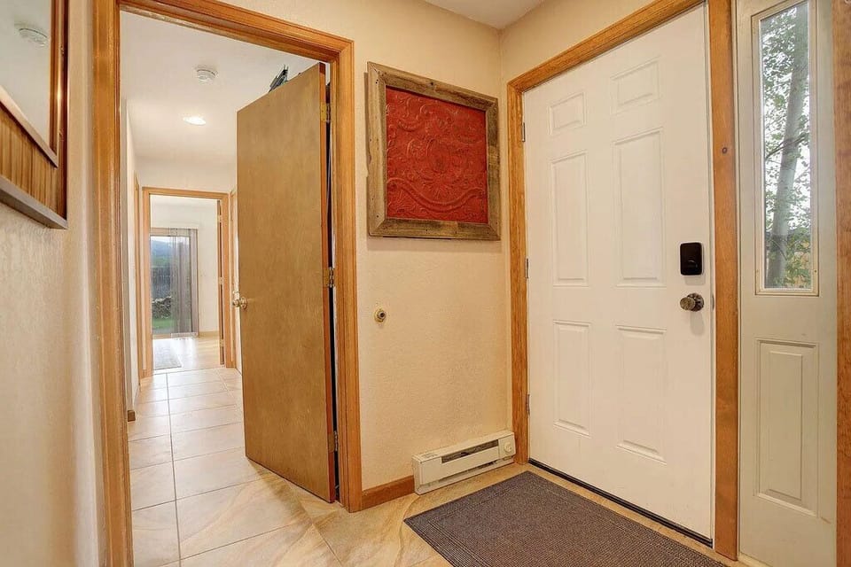 Step into your welcoming entryway with warm wood accents and thoughtful touches that make you feel right at home.