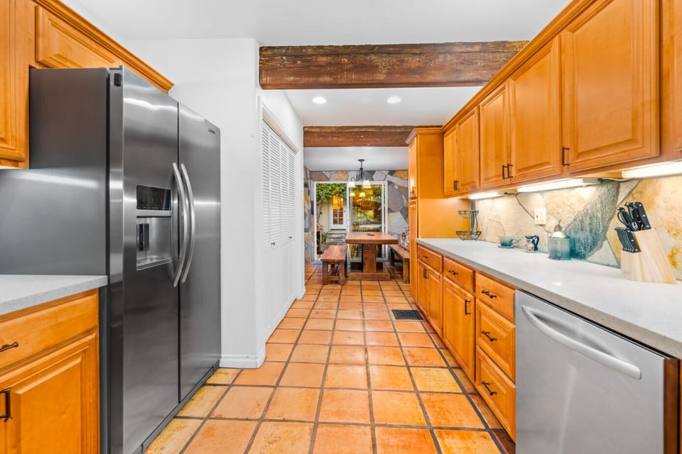 Kitchen is equipped with cooking basics and appliances.