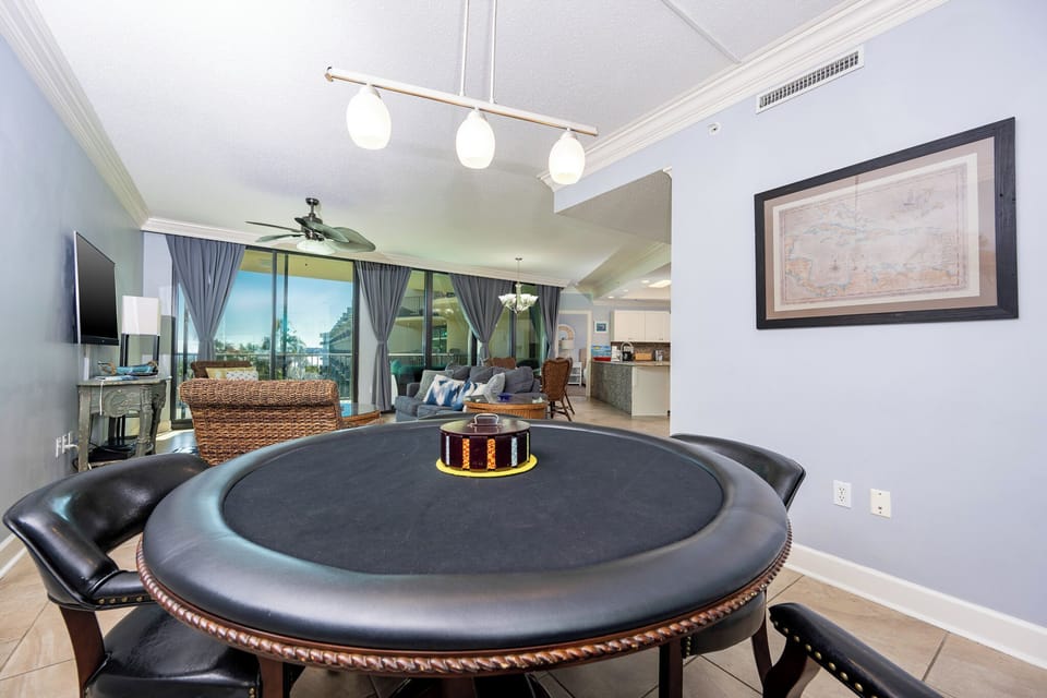 Enjoy a family game night at this fun gaming table surrounded by coastal accents and an elegant vibe