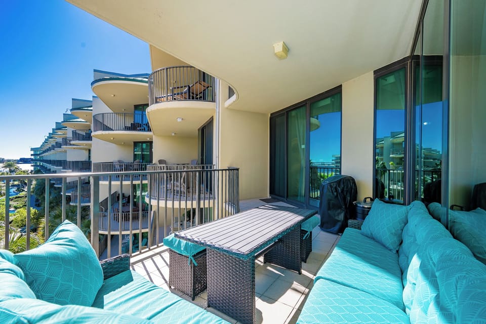 Relax on the cozy balcony sectional, enjoying fresh breezes and coastal views while sipping on your favorite drink
