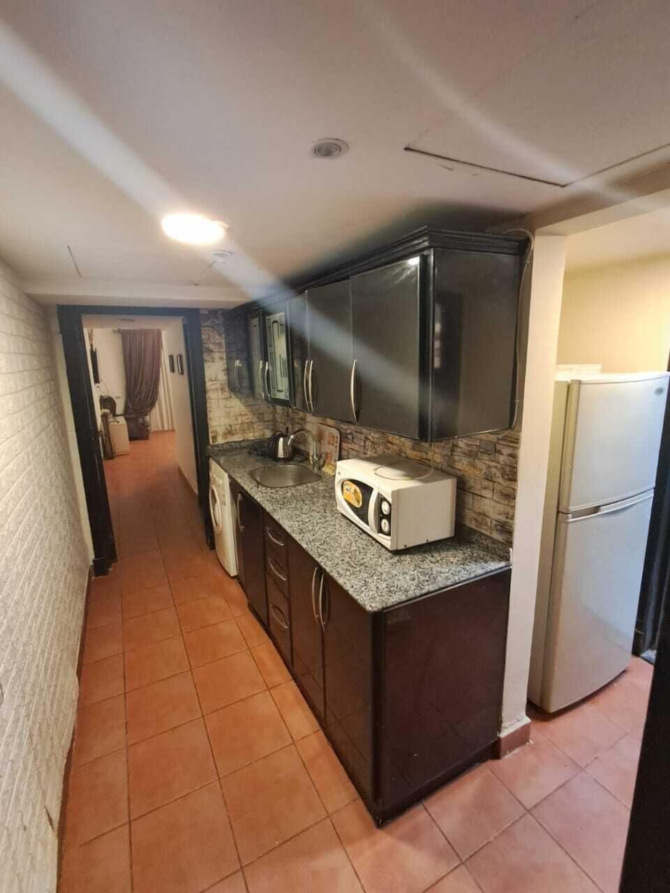 Fridge, microwave, stovetop, cookware/dishes/utensils