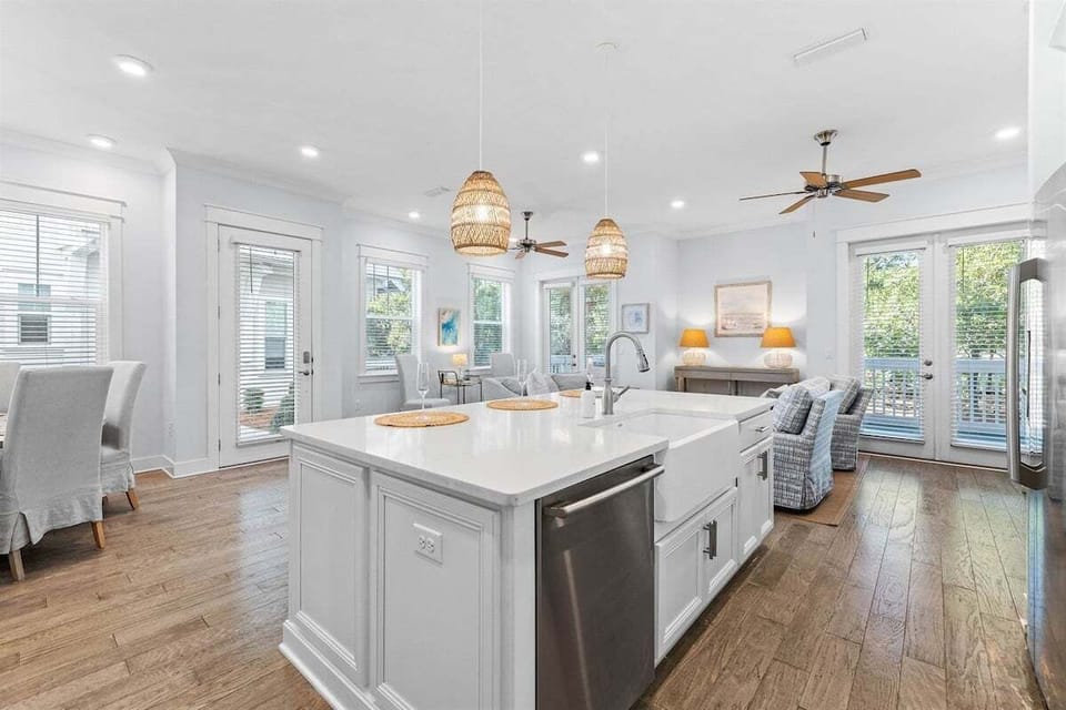 An open-concept kitchen with sleek countertops, pendant lights, and easy access to the living area.