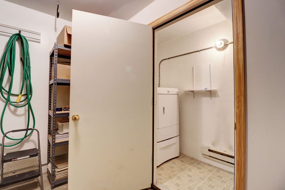 Washer and dryer are located in the garage.