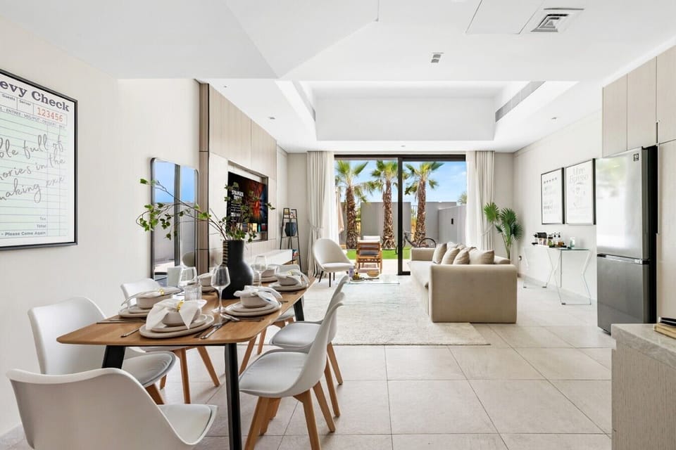 Dining area and living room with garden view