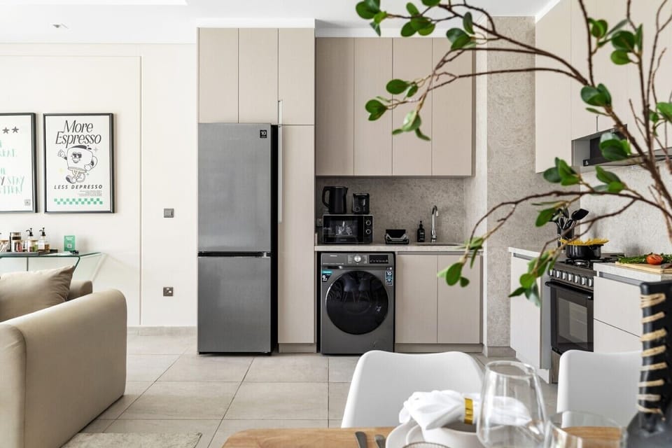 Kitchen with full-size fridge, washer, and oven