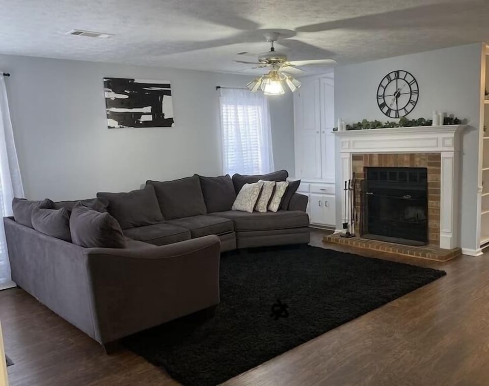 Living room with large sectional and 55 inch Roku smart tv 