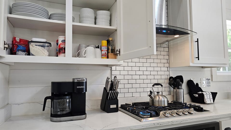 Fully stocked coffee bar with ground coffee & K-cup pods, sweeteners & creamer