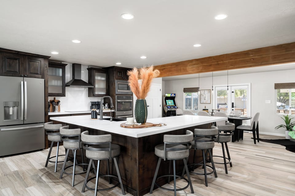 Barstool seating for 6, surrounding the kitchen island.