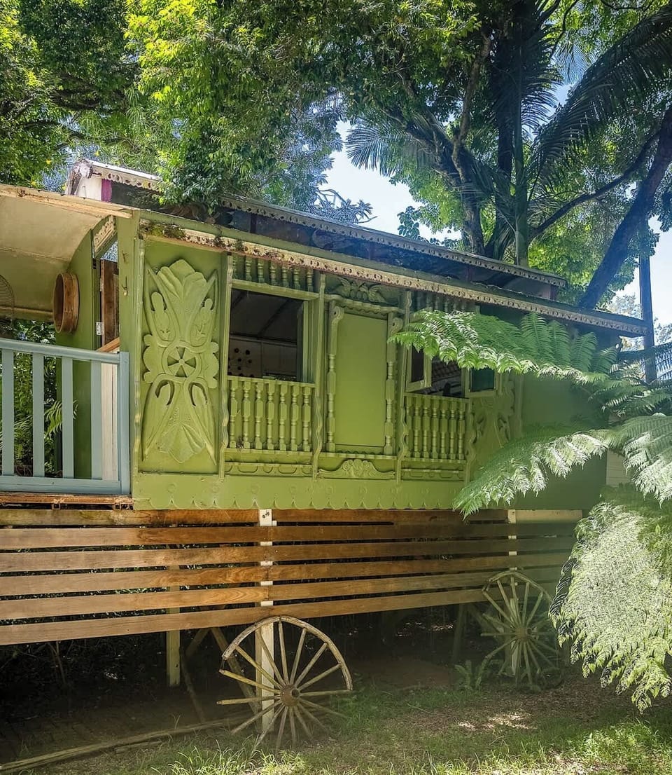 A charming Gypsy caravan sleeping space tucked beside this pet-friendly Bangalow cottage, adding a memorable and playful touch to your hinterland stay.