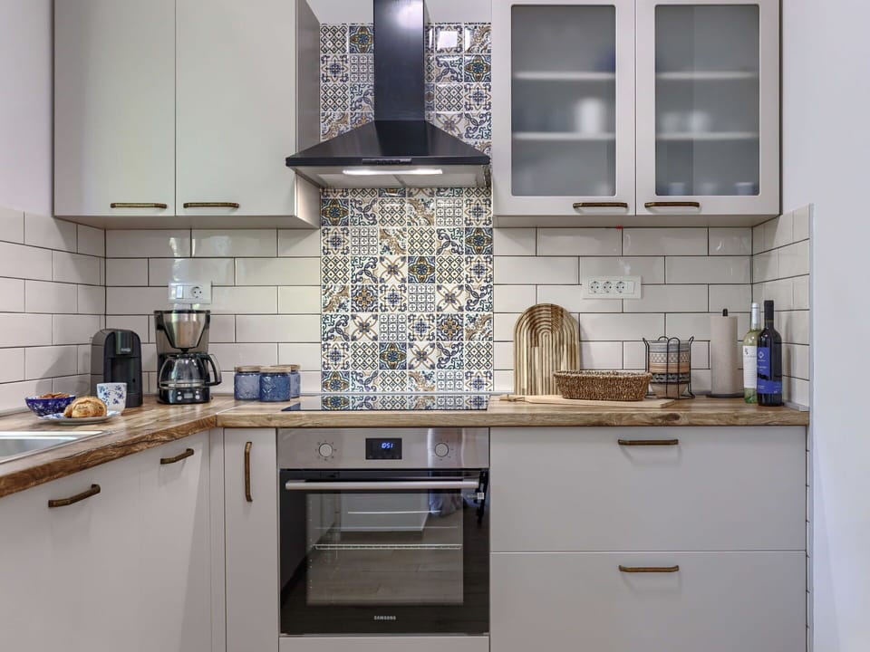 Kitchen, Countertop, Kitchen Appliance, Cabinetry, Major Appliance, Interior Design, Flooring, Floor, Tile, Cupboard