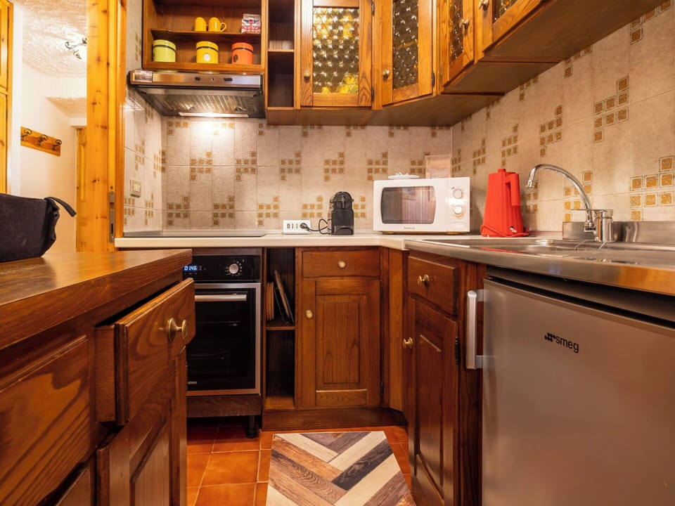 Cabinetry, Kitchen, Countertop, Wood, Interior Design, Major Appliance, Kitchen Appliance, Flooring, Furniture, Floor