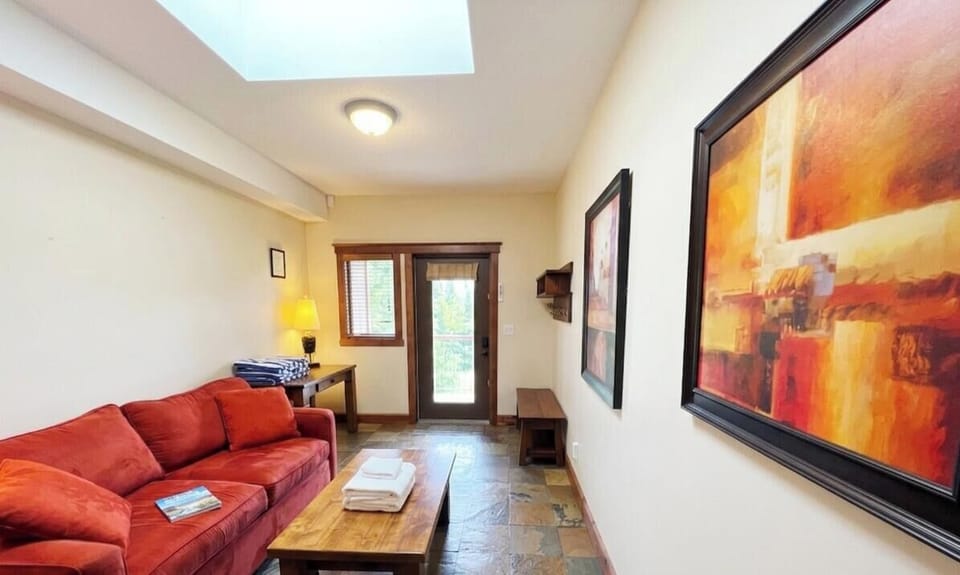 The bonus room leads out to the hot tub and slopes. Use it as a place to chill or an extra bedroom with a pull-out Double Sofa Bed (Lower Level). 