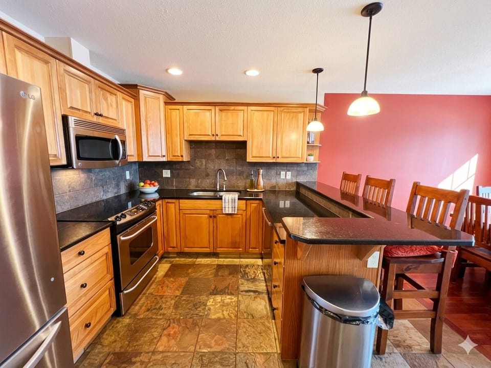 On the Main Living Level, a beautiful kitchen is loaded with all of the modern appliances you'll need to feed the crew.