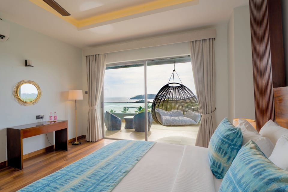 Deluxe Suite, Sea View | In-room safe, desk, laptop workspace, soundproofing