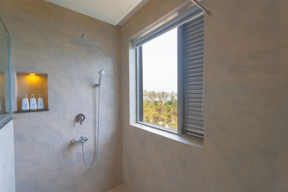 Executive Suite, Sea View | Bathroom | Shower, hair dryer, bathrobes, towels