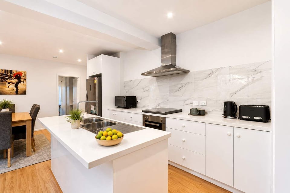 Bright, fully equipped kitchen with generous bench space and everything you need for meals at home.