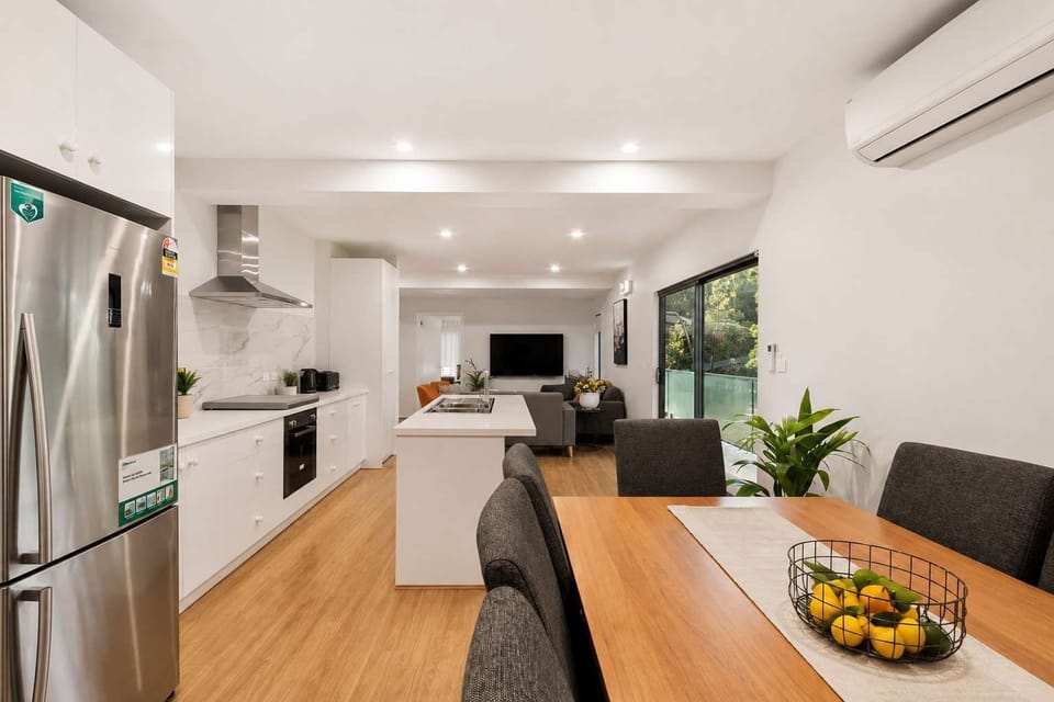 Generous open-plan kitchen, dining and living area with plenty of room for families and groups to come together.