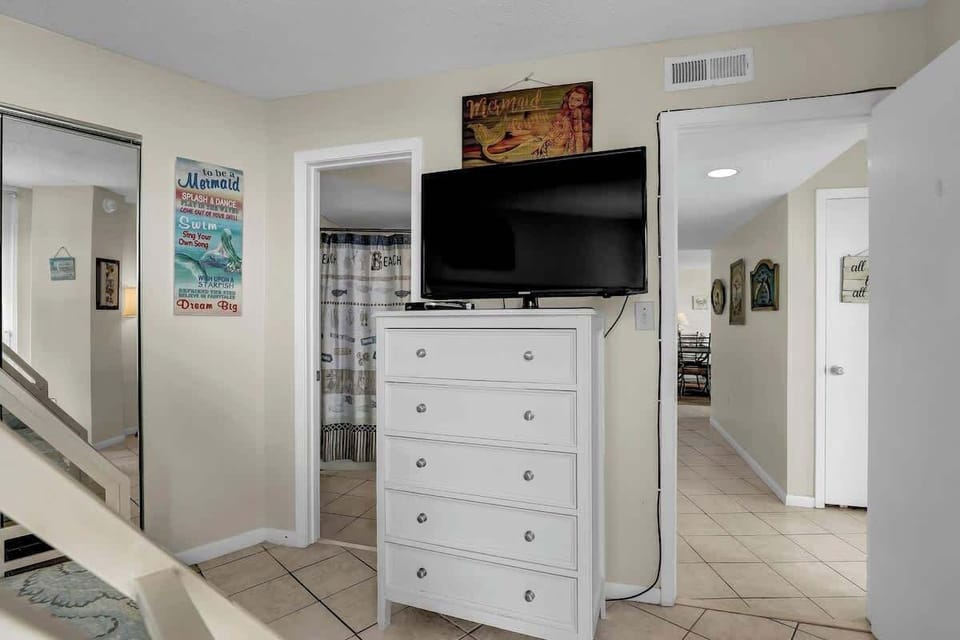 Spacious Dresser and TV Retreat Unwind with a good movie or your favorite show in this comfy, well-appointed space.