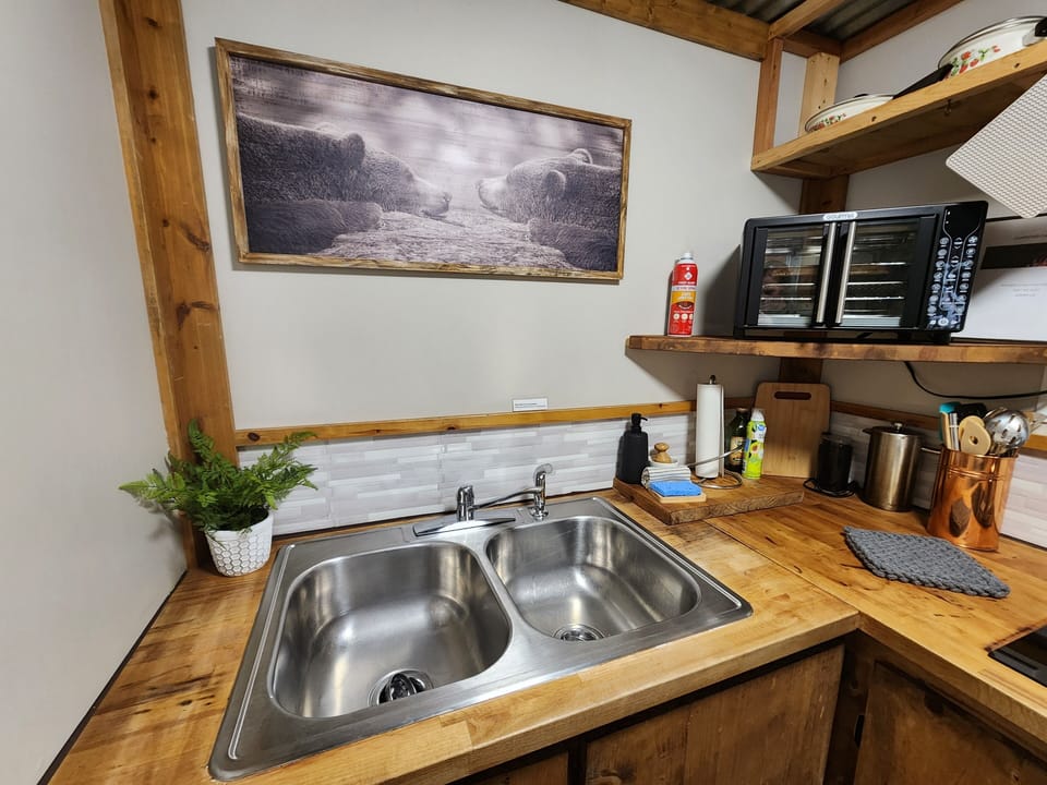 Coffee grinder, french press and tea pot provided.