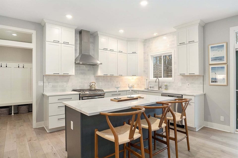 High end kitchen with stainless appliances and stone counters
