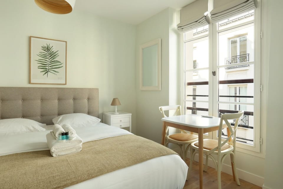 Apartment | Laptop workspace, iron/ironing board, bed sheets