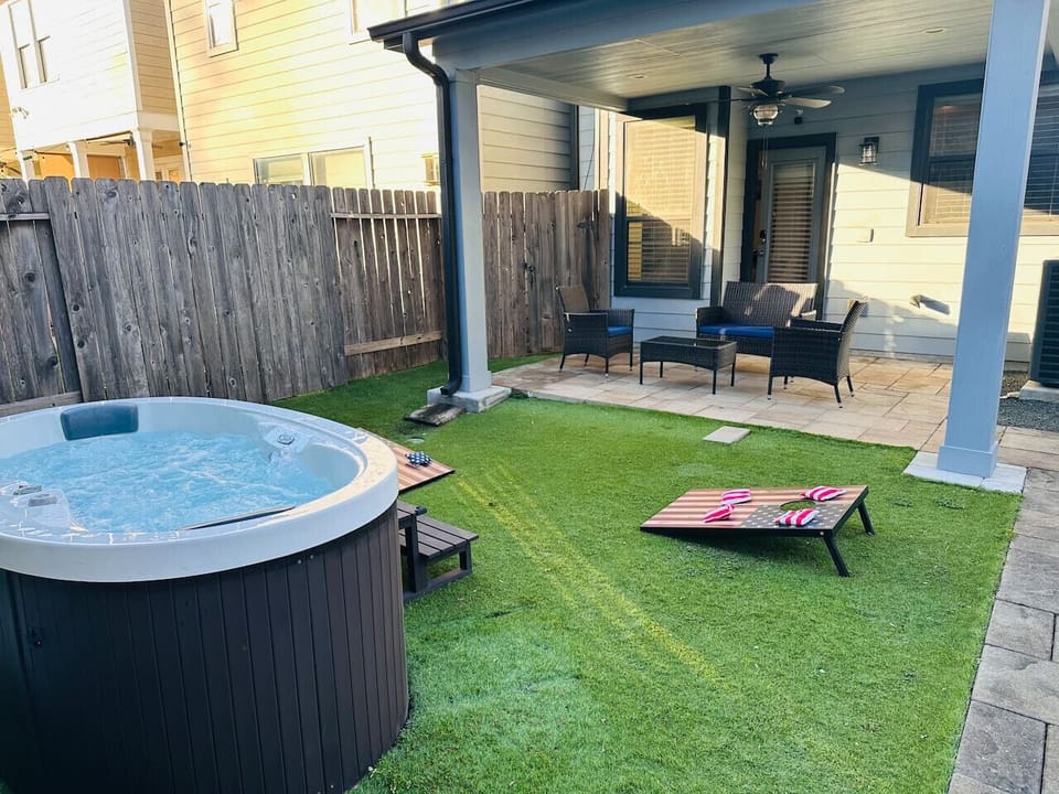 Private fenced backyard with hot tub... great for relaxation and fun!!