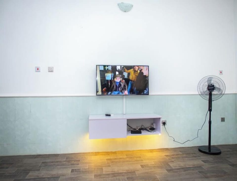 Family Apartment, Balcony, City View | Living area | Flat-screen TV