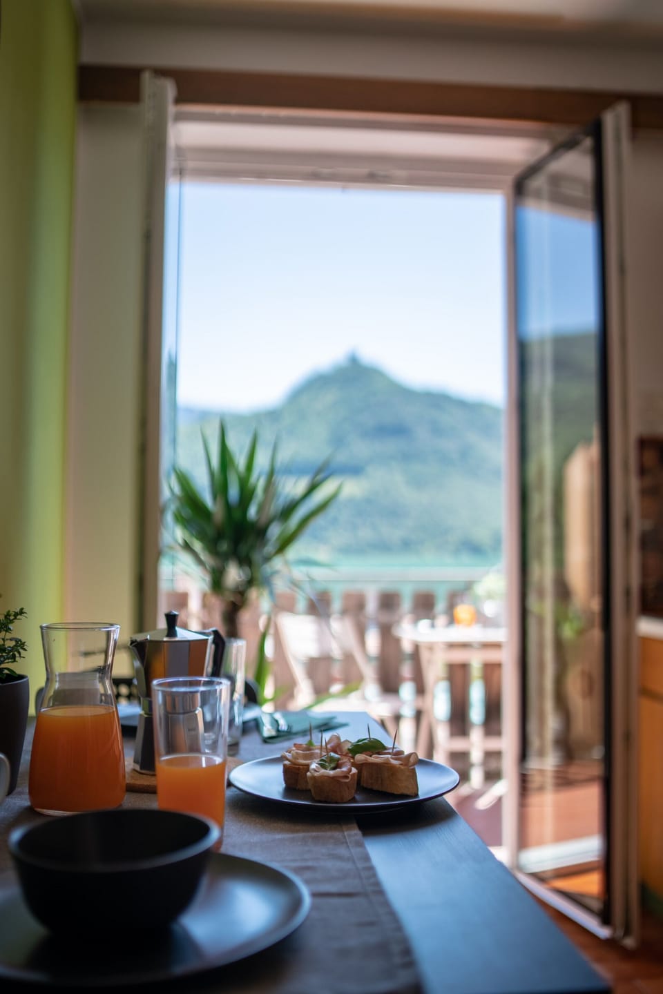 A laid table with a view of the castle hill
