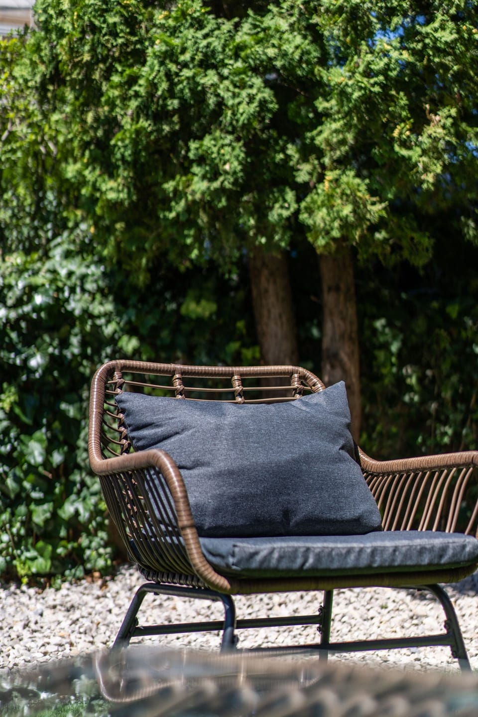 Armchair in the shade of the trees