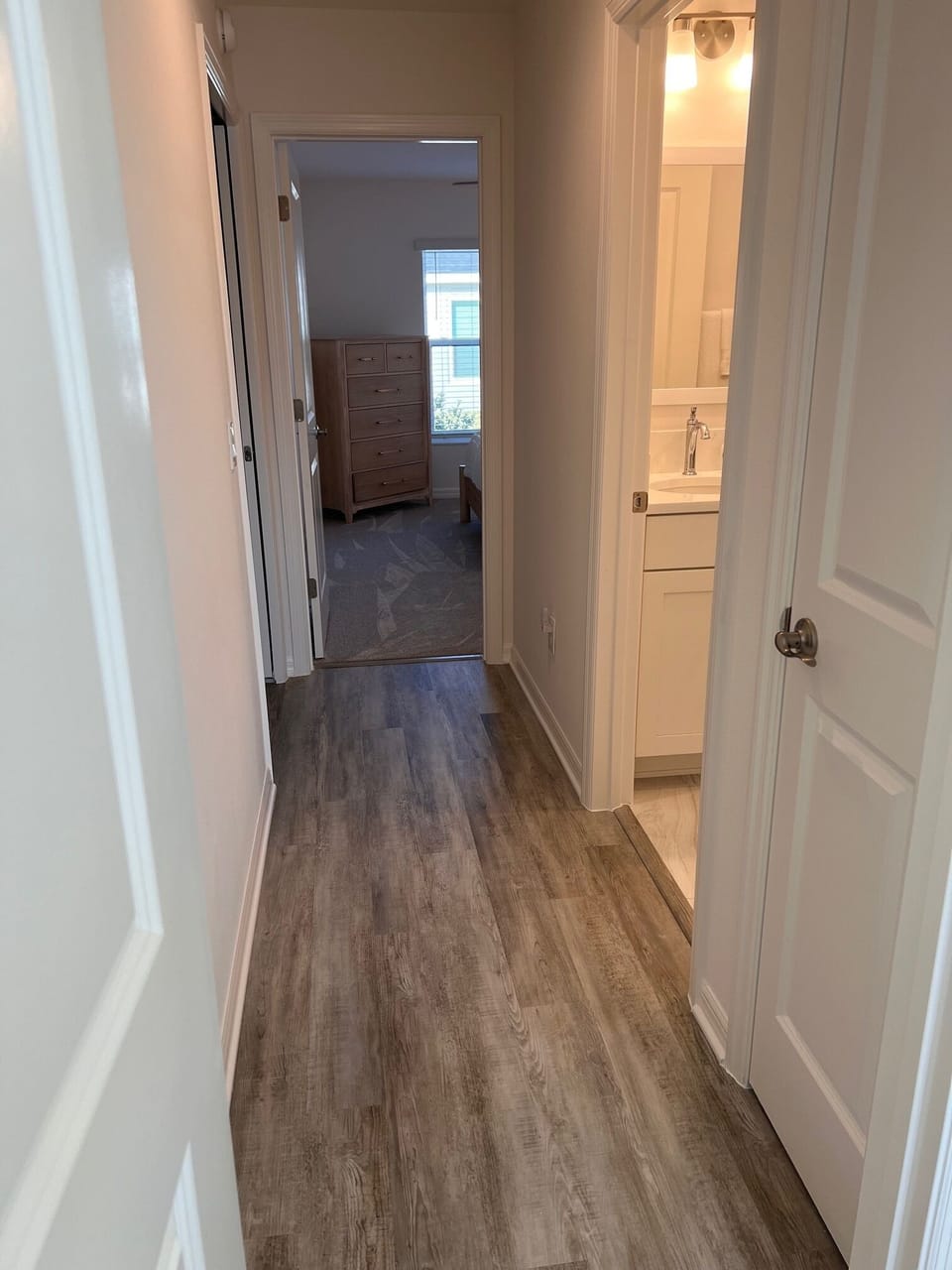 Hallway for bedroom #2, #3 and 2nd bathroom. There is a pocket door to close off