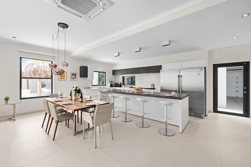 Discover a fully equipped kitchen, complete with everything you need to prepare your favorite meals, seamlessly connected to a charming dining area – the perfect space for cooking, dining, and creating lasting memories.