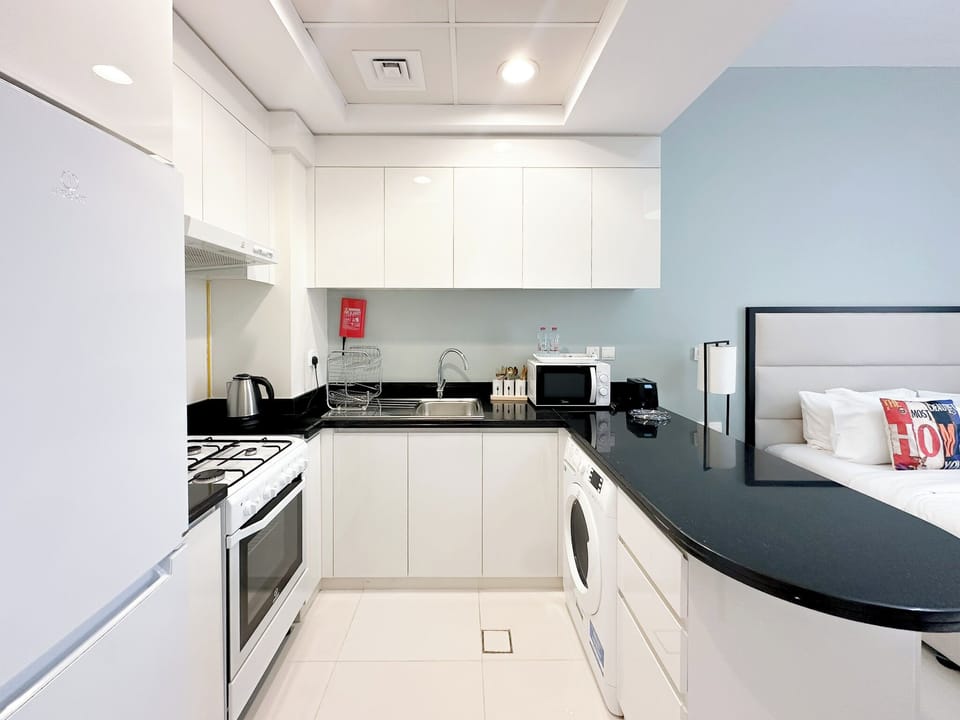Comfort Studio, Balcony, City View | Living area | 45-inch Smart TV with cable channels