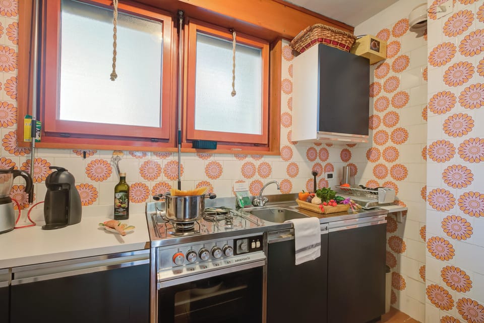 Standard Apartment, Multiple Bedrooms (Lo Stambecco) | Private kitchen | Fridge, oven, stovetop, coffee/tea maker
