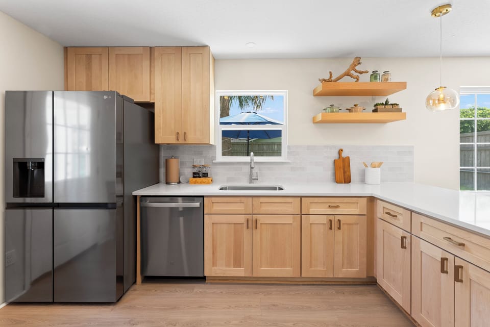 Fully equipped kitchen with Ninja blender—ideal for healthy, peaceful stays.