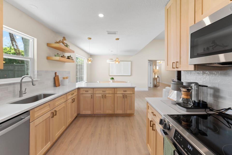 Bright, spacious kitchen—fully stocked for comfort, recovery, and ease.