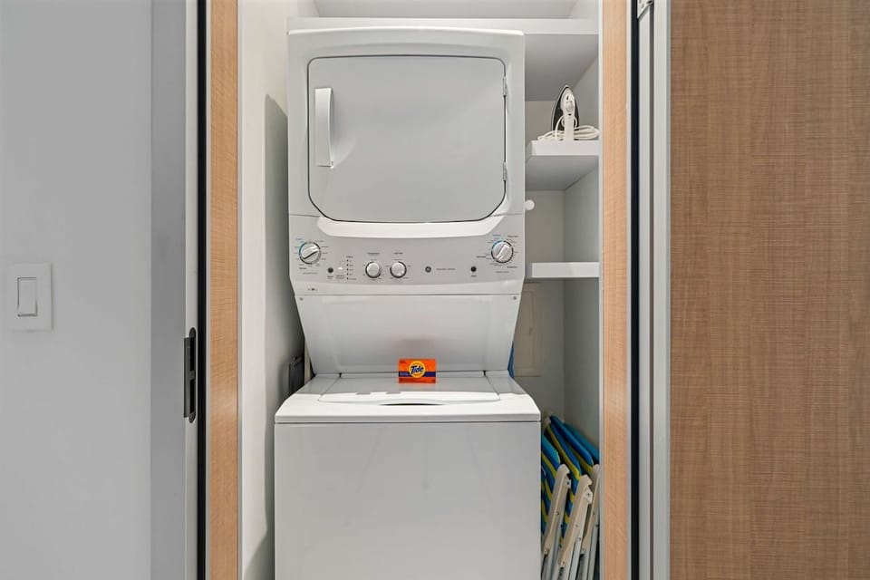 - Convenience meets style with this compact yet efficient laundry setup
- Built-in storage and modern appliances make it easy to stay fresh and organized
- Perfect for keeping your wardrobe spotless during your stay