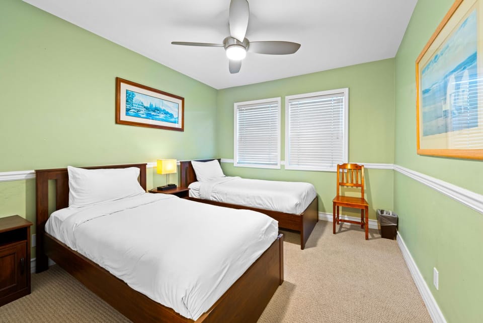 Guest bedroom with twin beds and a chair