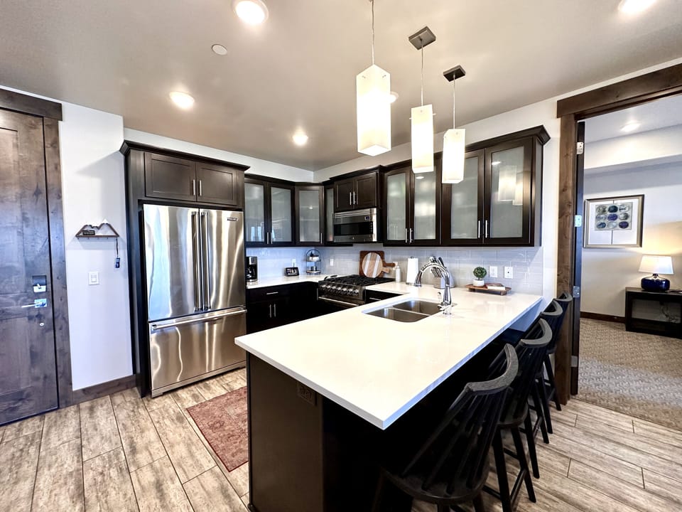 Experience the perfect blend of modern and mountain. This open-concept home features high-end Viking appliances, a stone gas fireplace, and a spacious kitchen island perfect for gathering.