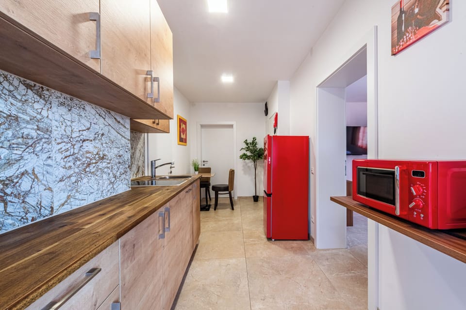Basic Apartment | Living area | Flat-screen TV