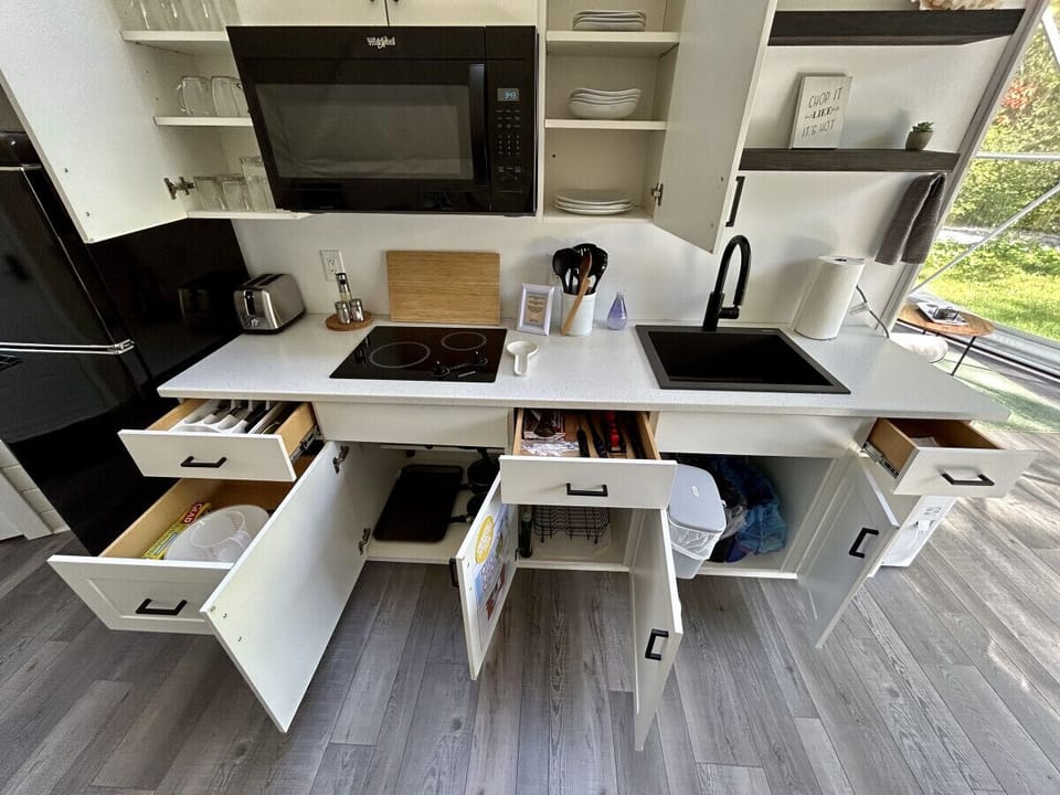 Kitchen with drawers open & stocked