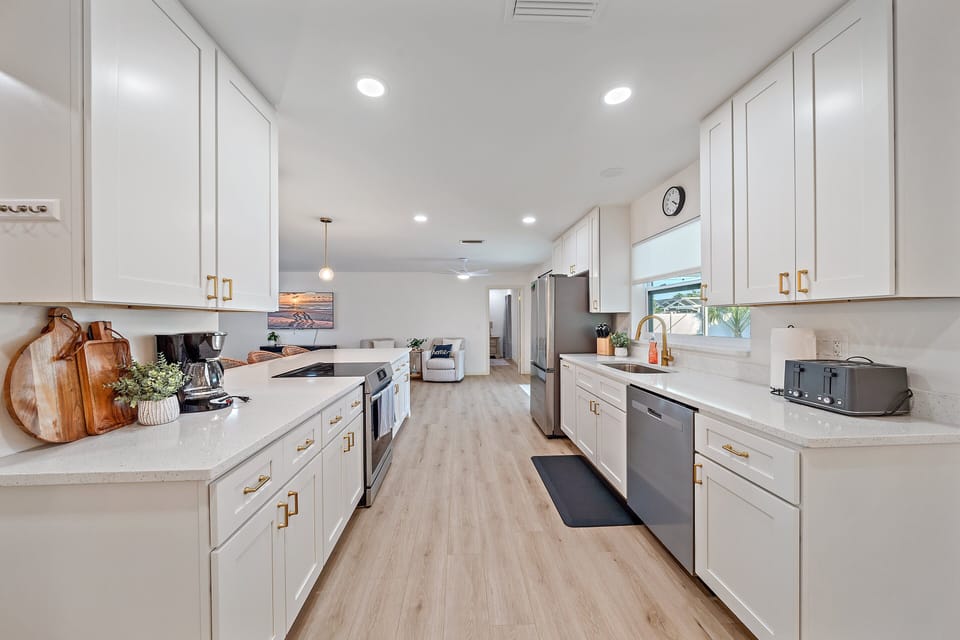 Large countertops, new stainless steel appliances, and such an incredible kitchen island! You'll be cooking in luxury!
