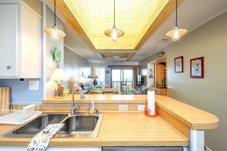 Spacious open-concept kitchen and living area perfect for relaxing beach getaways